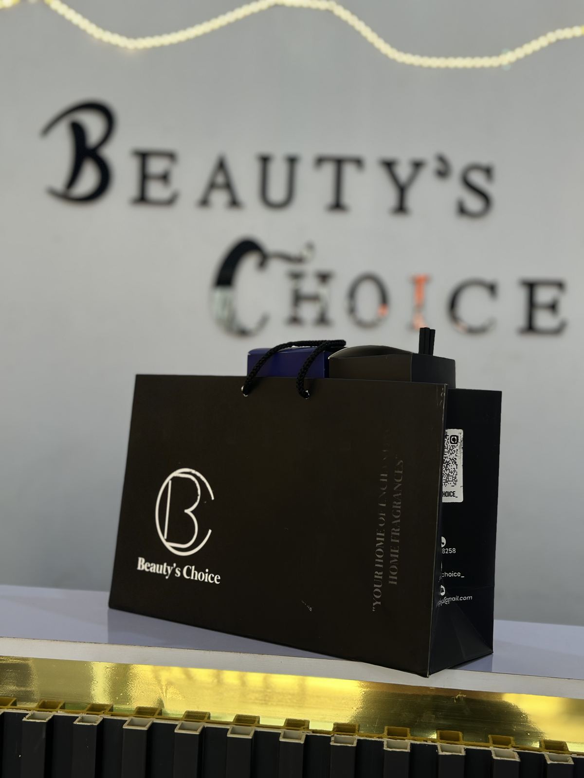 Beauty's Choice storefront signage and gift bag